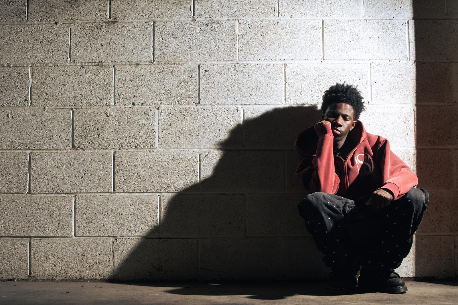 Skizzy jeans + hoodie + brickwork